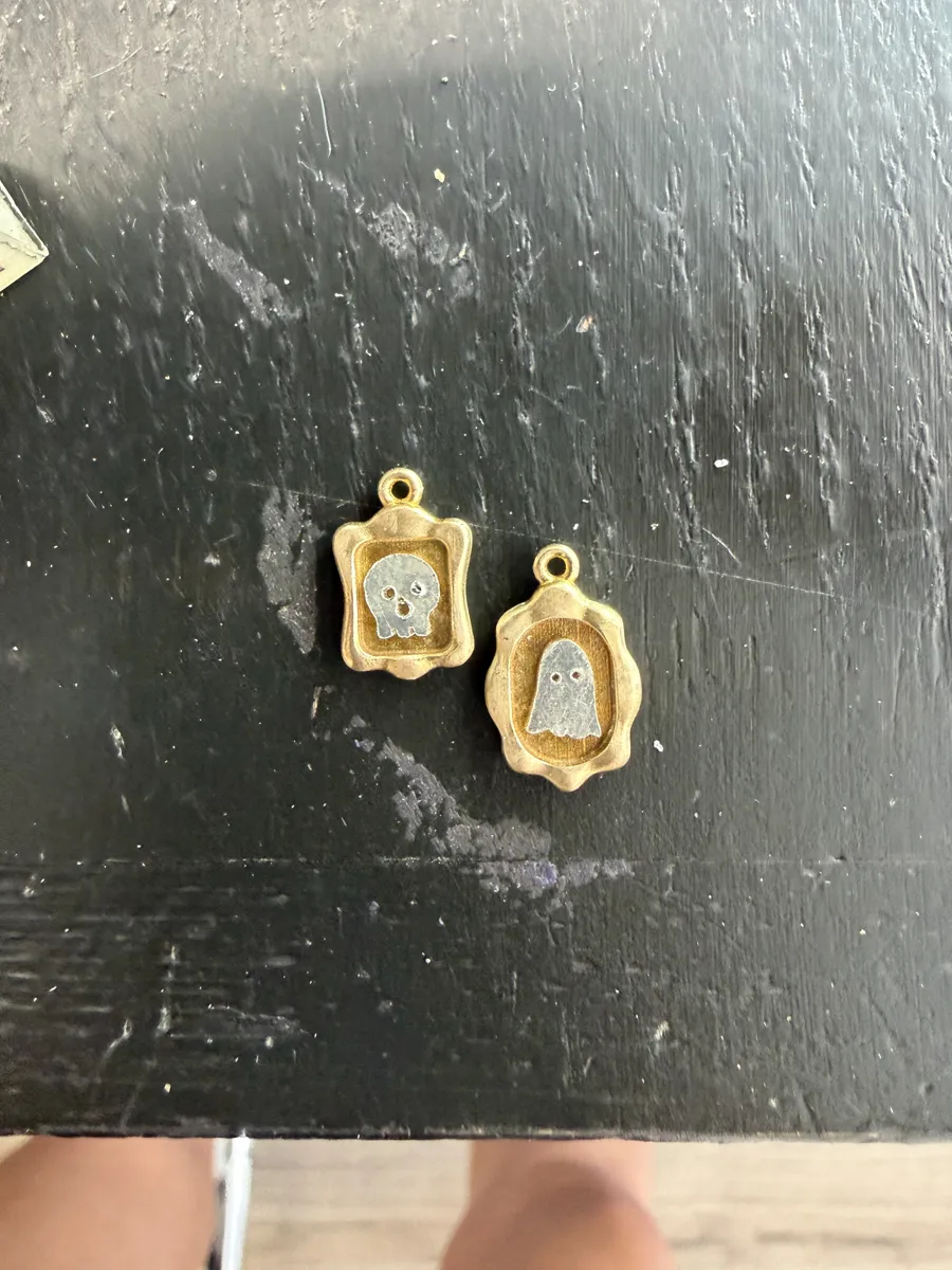 Cast frames with silver ghost and skull inlays